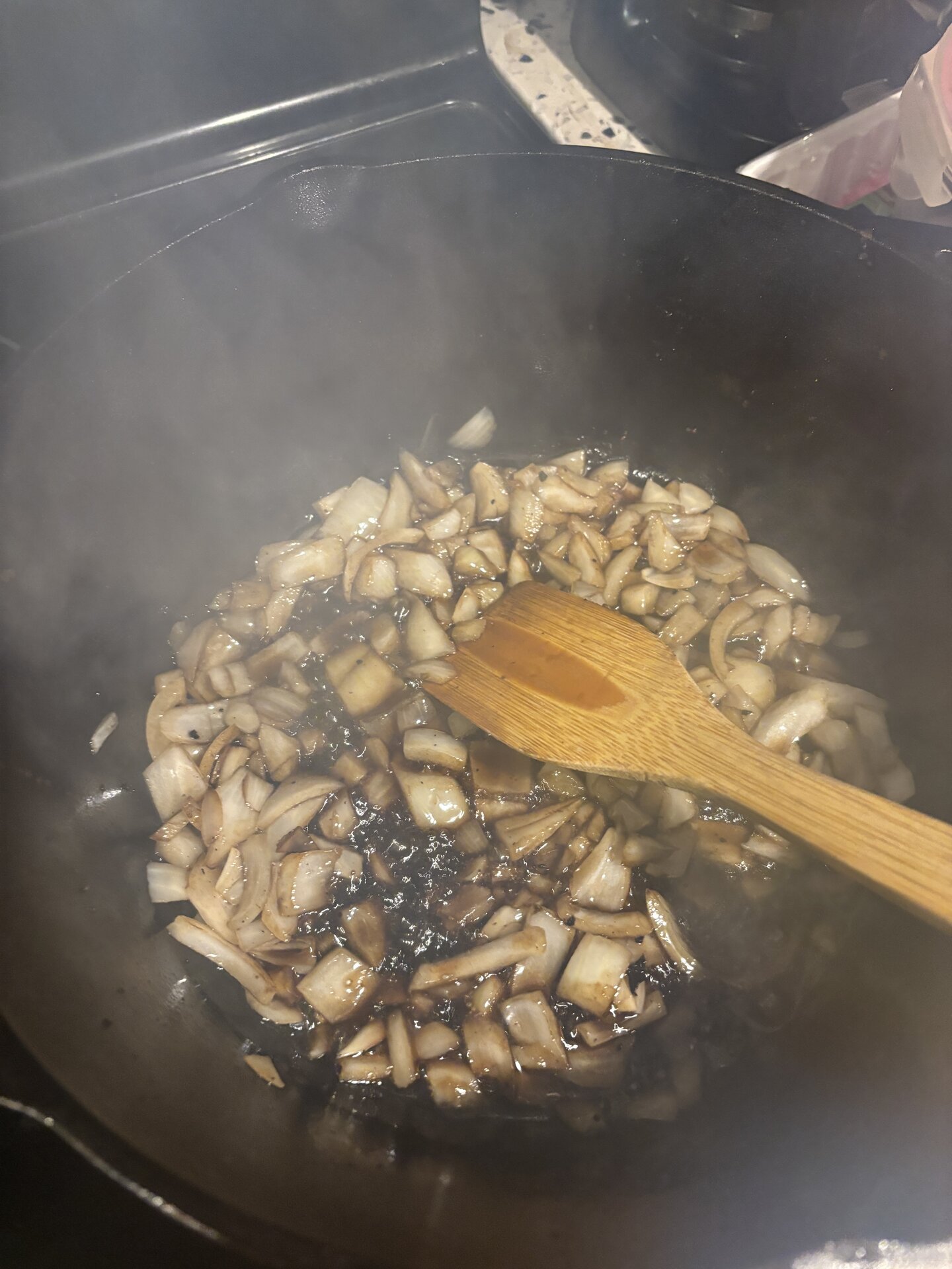 Ground veal browning with the vegetables, still some pink visible